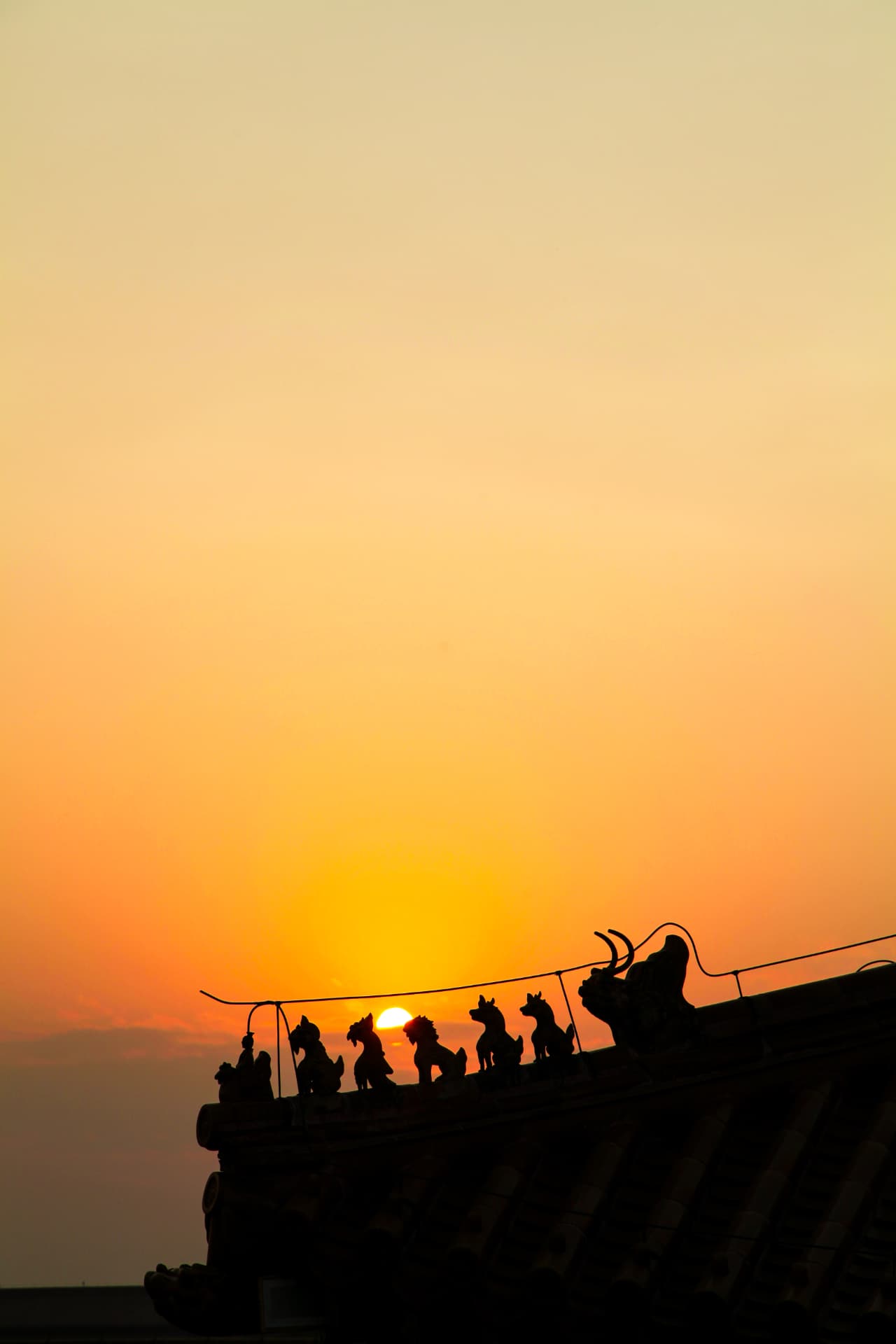 Roof Guardians at Sunset